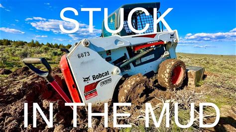 getting skid steer unstuck|skid steer stuck in mud.